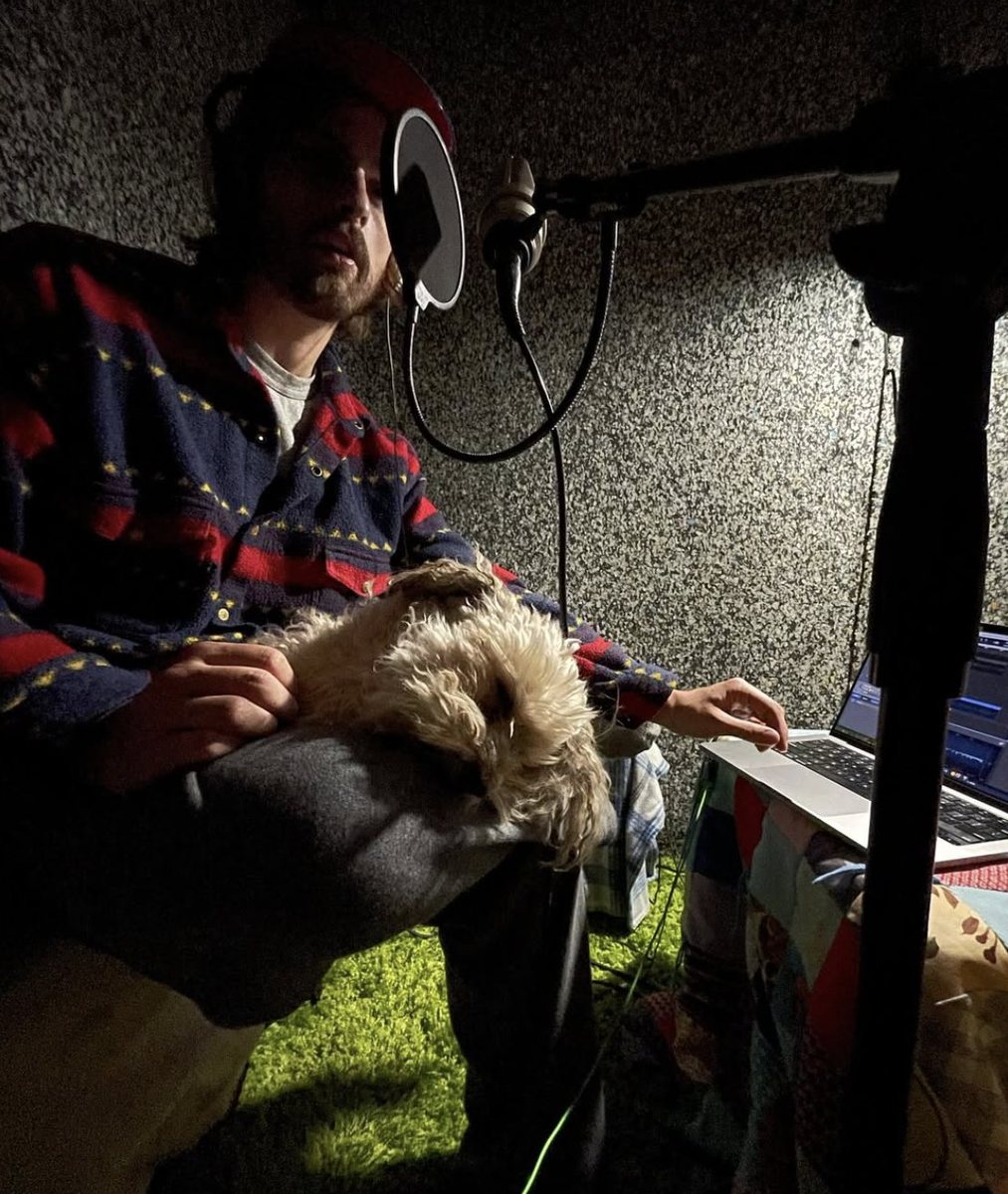Roland Dixon at home with his dog